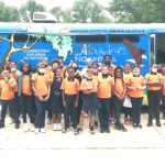 The students stadin in front of the nature bus